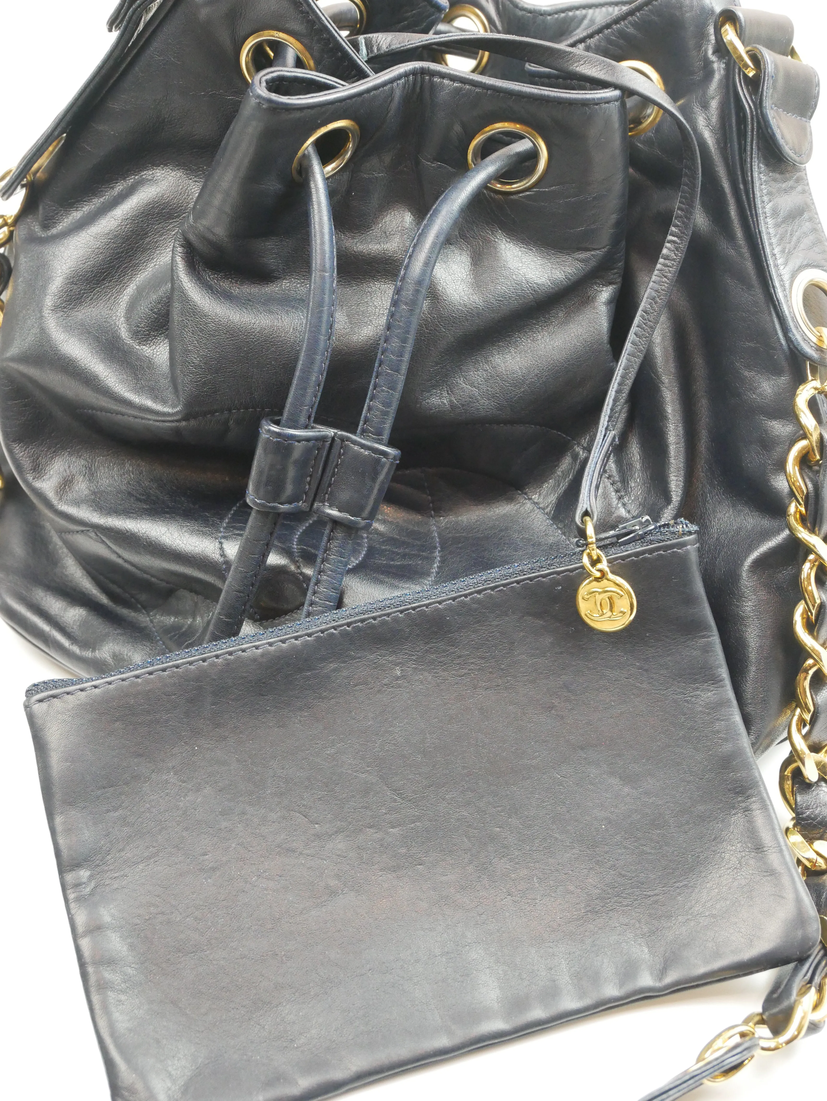 Chanel black bucket bag with logo on the front and gold detail - 1980s