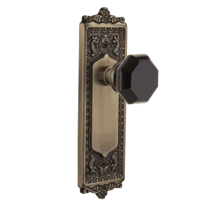 Egg & Dart Long Plate with Black Waldorf Knob in Antique Brass