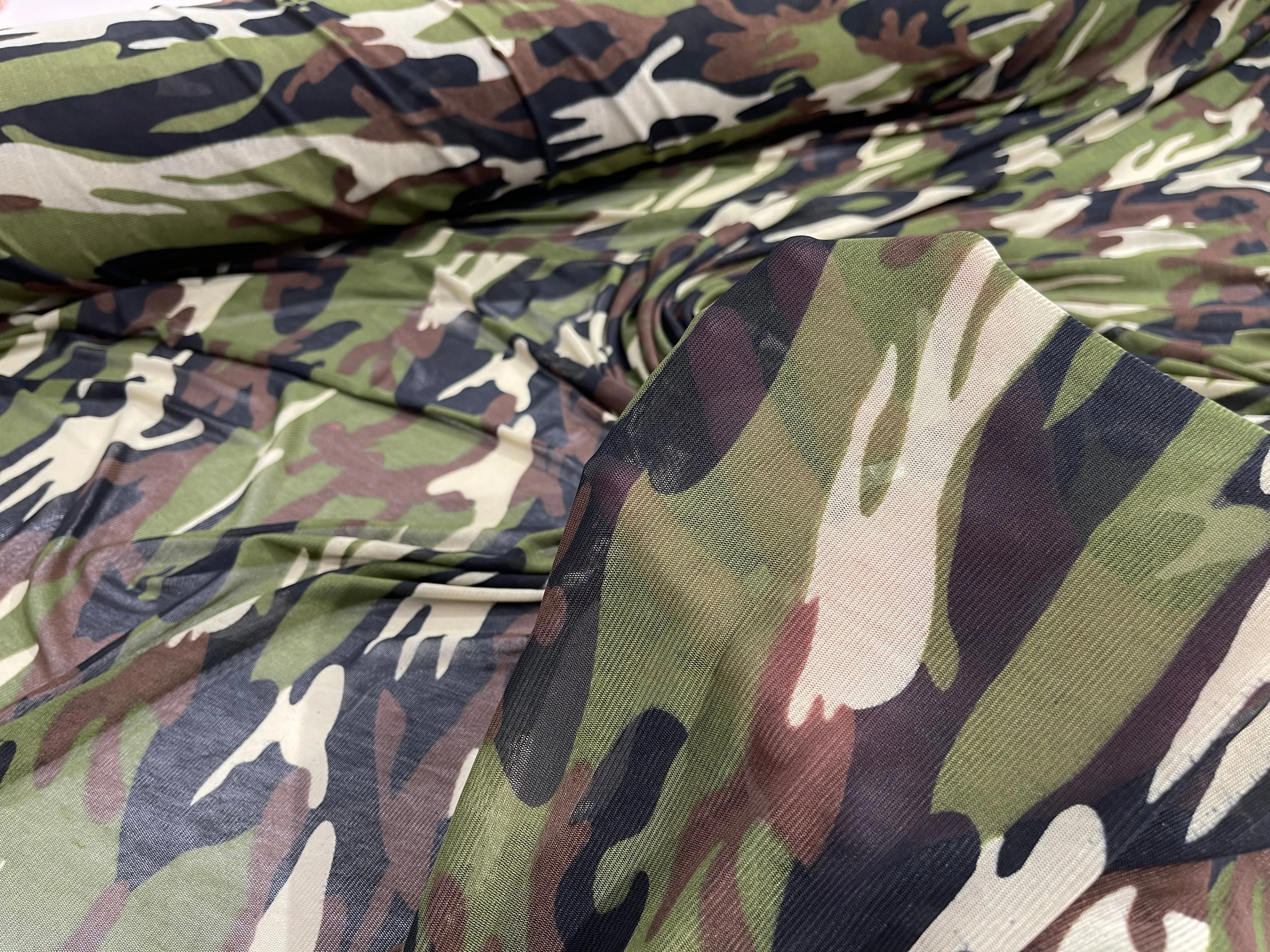 Green/ Tan/ Black Camouflage design on a Brown power mesh 4-way stretch 58"-Sold by the yard.