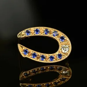 Vintage Gold Sapphire Diamond Horseshoe Brooch